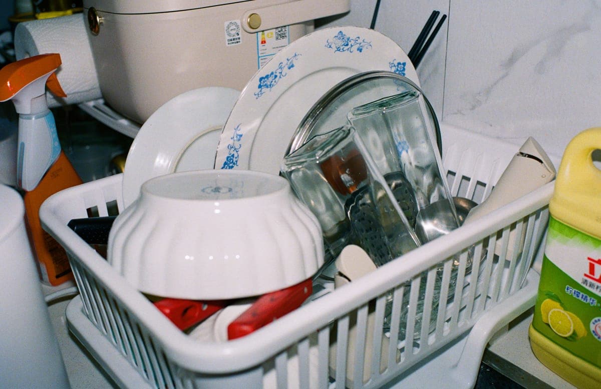 Clean kitchen parts drying beside a sink